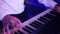 Hands of musician playing keyboard in concert