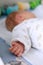 Hands from newborn sleeping baby