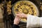 Hands of newly married on clock background