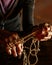 Hands of old woman with polyarthritis disease. Canvas strings on fingers of elderly lady, puppets