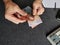 hands of an older man counting australian banknotes