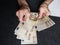 hands of an older man counting european banknotes