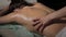 Hands of osteopath doing manipulative massage on female back. Massage therapy and detoxification