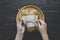 hands pack bread on a dark wooden background