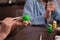 Hands paint Easter eggs in a modern style with green paint. creativity with children, traditional symbols. Preparation