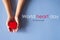 Hands people holding red heart model on blue background,World heart day concept