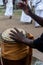 Hands of a percussionist playing atabaque at a religious event