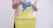 Hands, person and medical waste bin with gloves, healthcare for safety and hygiene on white background. Health, wellness