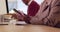 Hands, phone and business woman in office texting while working on computer closeup. Smartphone, contact and lady