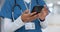 Hands, phone and healthcare with a nurse scrolling in a hospital closeup for research or networking. Medical