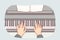 Hands of pianist playing classical composition on piano during symphony concert at opera house