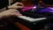 Hands playing on piano midi keyboard in home music studio. Close up of musician creating new song for music album. Recording studi