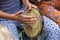 Hands playing tambourine during capoeira performance