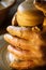 Hands of a potter, creating an earthen jar