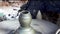 Hands of a potter. Potter making mud ceramic pot on the pottery wheel