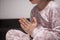 Hands in prayer. The child is praying. Prayer for the night. In pajamas