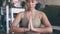 Hands, prayer and namaste, woman and meditation with yoga for fitness in living room and holistic healing, wellness and