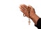 Hands praying with rosary bead cross