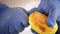 Hands of professional chef peeling potatoes detail