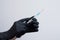 Hands in protective gloves with a syringe and antiseptics