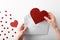 Hands pull out of white mail envelope heart on white background