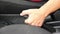 Hands Pulling Handbrake Of A Car