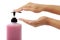 Hands pushing pump plastic bottle isolated