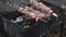 Hands putting meat skewers on charcoal grill. Cooking meat barbecue on grill