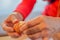 Hands removing the eggshells in a restaurant