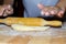 Hands with rolling kneading dough