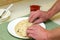 Hands Rolling Salmon Spread in Tortilla