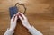 Hands with rosary over old Holy Bible