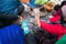 Hands of rural minority people warming up around the fire during the cold weather days in mountaious region in Vietnam