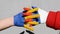 hands of russian and ukrainian flags colors, symbol of truce and consent between Russia and Ukraine, stop war in Ukraine