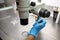 Hands of a scientist in the laboratory with a test tube and a microscope. The invention of the vaccine, a doctor in the clinic of