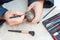 Hands of sculptor making sculpture head using tools