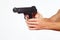 Hands with semi-automatic gun on white background