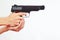 Hands with semi-automatic pistol on white background