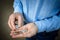 Hands of a senior citizen with cents, senior man counts his money. The concept of poverty, small pension, lack of savings