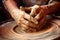 hands shaping clay on potters wheel, motion blur