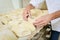 Hands shaping dough into loaves