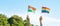 Hands showing LGBTQ Rainbow and India flag on nature background. Support Lesbian, Gay, Bisexual, Transgender and Queer community