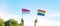 Hands showing LGBTQ Rainbow and Singapore flag on nature background. Support Lesbian, Gay, Bisexual, Transgender and Queer