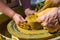 hands of the skilled master Potter and children\'s hands, training of the kid to production of pottery on a Potter\'s wheel