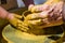 hands of the skilled master Potter and children\'s hands, training of the kid to production of pottery on a Potter\'s wheel