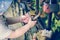 The hands of a small child hold a love lock fastened to the railings of the bridge