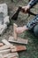 Hands with split wooden board