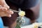 hands are squeezing small pliers for Cactus pollination