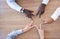 Hands, star and collaboration overhead with a business team in the office sitting at a boardroom table. Hand sign, shape