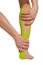Hands stretch my leg with taped tape in the process of recovering from injury, stretching